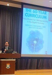 60 year curriculum slide displayed with Prof. LEE at the podium.