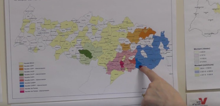 Person pointing out data visualization features on a map.