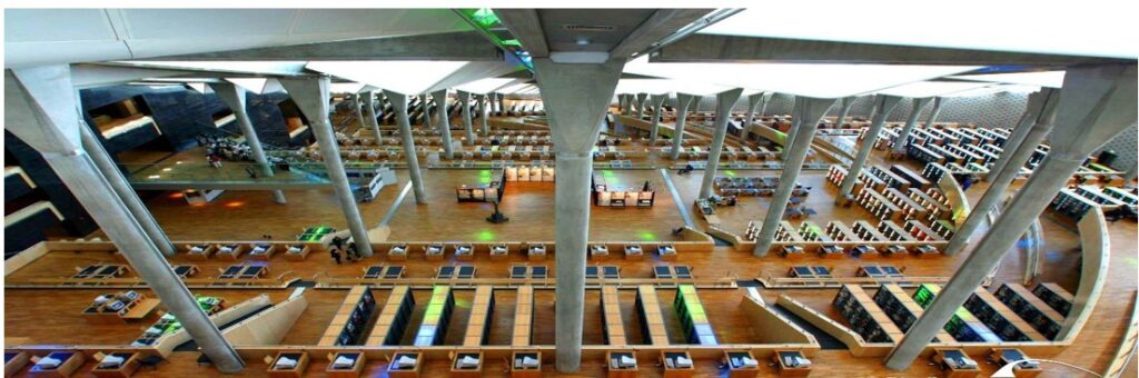 Bibliotheca Alexandrina with columns and high ceiling and rows of reader desks.