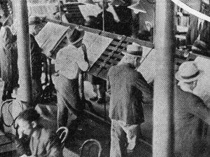 Patrons reading newspapers in the State Library of Queensland, 1934 (Public Domain, Author Unknown)