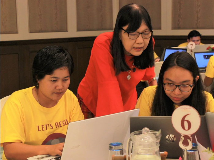 Woman in workshop on computers 